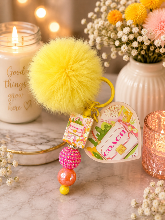 Coach-Inspired Yellow Pom-Pom Keychain
